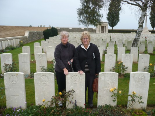 Image of Margaret McMaster and Helen Cooper, great nieces of Edward Claude Perkins visiting his grave in 2011